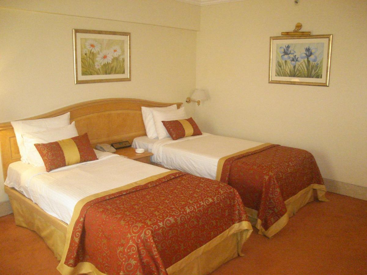 Готель Ramada Plaza By Wyndham Palm Grove Мумбаї Екстер'єр фото A room at the hotel